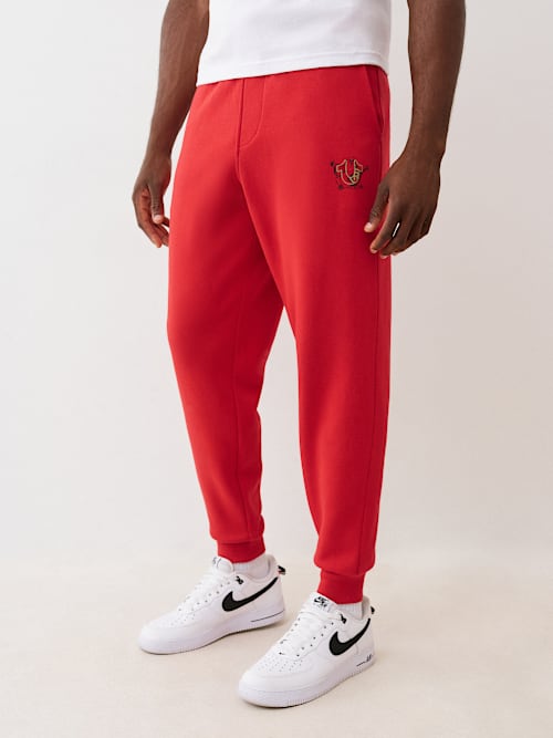 ДЖОГГЕР С ЛОГОТИПОМ И СЛОЕНЫМ ПРИНТОМ ДЛЯ БЕГА ТРУСЦОЙ