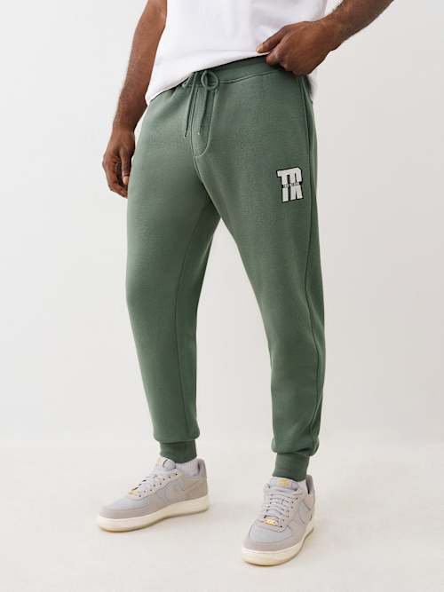 БЕГУНЬЯ ТРУСЦОЙ С РАДУЖНЫМ ЛОГОТИПОМ