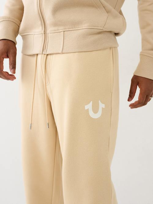 ФЛИСОВЫЙ ДЖОГГЕР НА ЗАВЯЗКАХ С ЛОГОТИПОМ В ВИДЕ ПОДКОВЫ