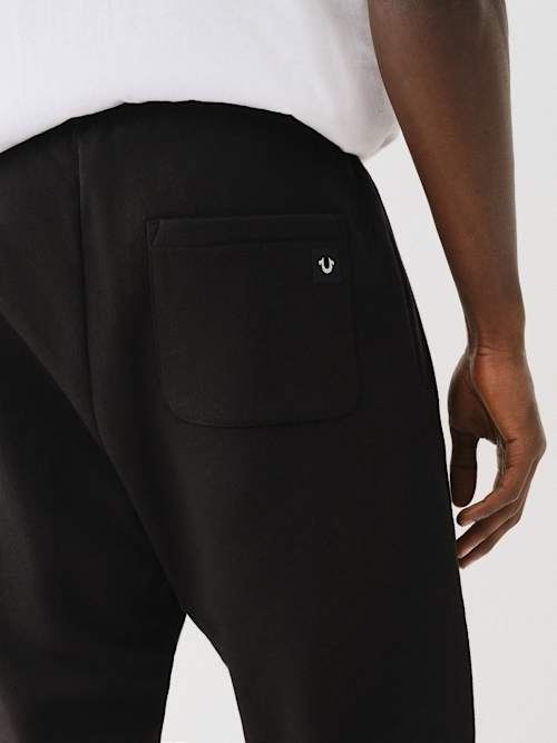 PANTALONES JOGGER CON HERRADURA DE ESTRELLAS