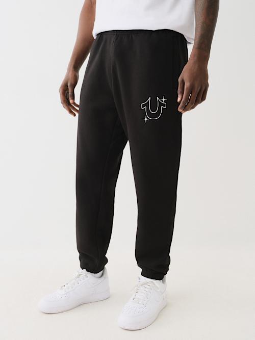 PANTALONES JOGGER CON HERRADURA DE ESTRELLAS