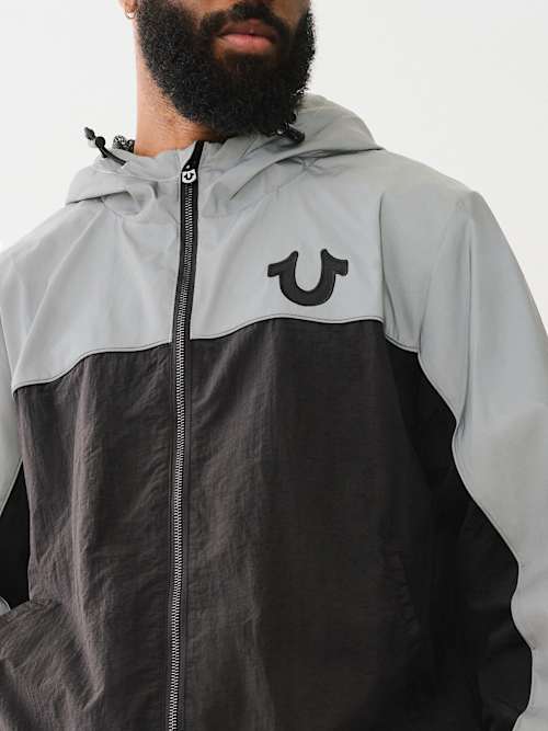 СВЕТООТРАЖАЮЩАЯ ВЕТРОВКА С КАПЮШОНОМ НА МОЛНИИ