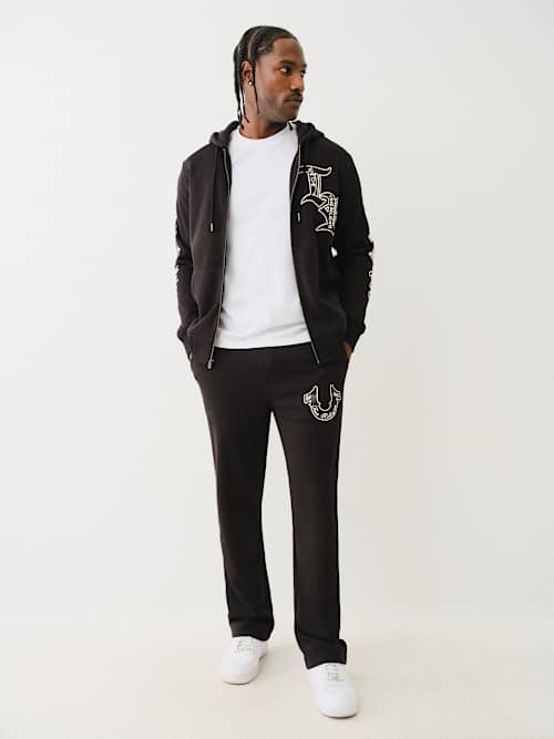 PANTALÓN DEPORTIVO CON HERRADURA PROPERTY OF NONE