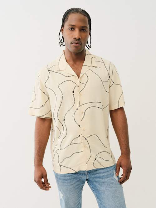 CAMISETA CON CUELLO CAMPANA Y COSTURAS DE BÉISBOL
