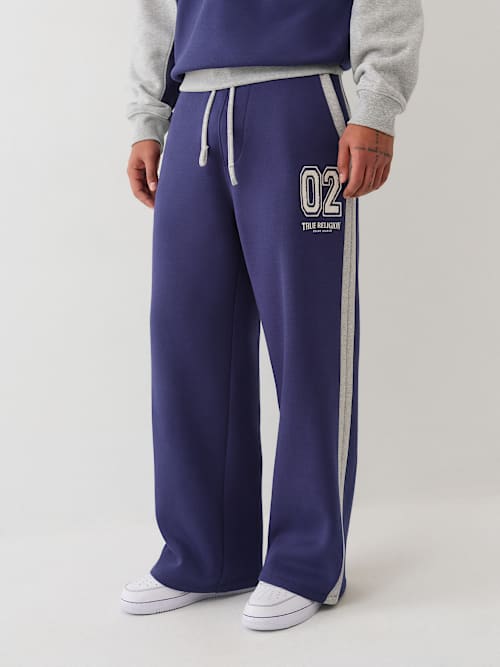 МЕШКОВЫЕ СПОРТИВНЫЕ БРЮКИ В ЦВЕТНУЮ ПОЛОСКУ