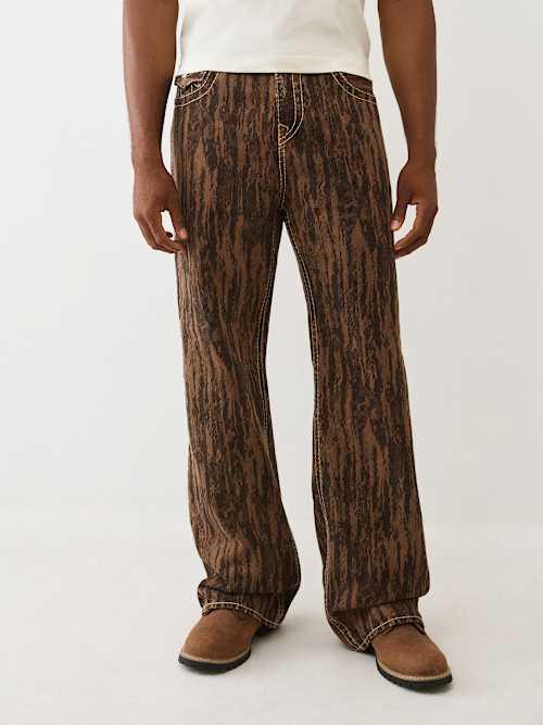 УЛЬТРАМЯГКИЕ ДЖИНСЫ С ПРИНТОМ ”ВИННИ ВУД ЗЕРНИСТОСТЬ