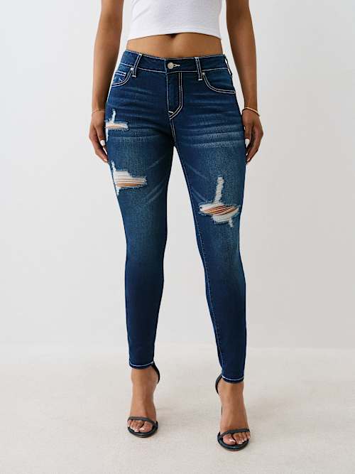 JEANS SKINNY JENNIE CURVILÍNEOS DE TIRO MEDIO GASTADOS