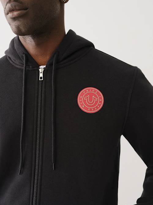 SUDADERA CON CAPUCHA Y CIERRE CON GRÁFICO DE CUERDAS