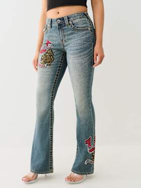 BECCA CRYSTAL TATTOO MID RISE BIG T BOOTCUT JEAN