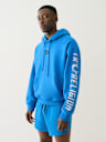 SUDADERA DEPORTIVA CON CAPUCHA, HERRADURA Y LOGOTIPO DE TRUE CEÑIDA