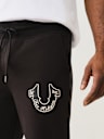 PANTALÓN DEPORTIVO CON HERRADURA PROPERTY OF NONE