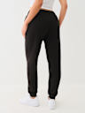 PANTALONES JOGGER CON DETALLES METÁLICOS Y CRISTALES