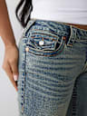 JEANS JOEY ACAMPANADOS DE TIRO BAJO CON SOLAPA