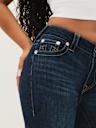 JEANS SKINNY CURVILÍNEOS JENNIE DE TIRO MEDIO