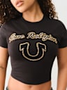 CAMISETA PEQUEÑA MANGA CORTA CON LOGOTIPO EN CRISTAL