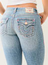 JEANS SKINNY CURVILÍNEOS SUPER T JENNIE DE TIRO MEDIO
