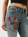 BECCA CRYSTAL TATTOO MID RISE BIG T BOOTCUT JEAN