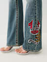 BECCA CRYSTAL TATTOO MID RISE BIG T BOOTCUT JEAN