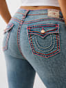 PLUS JENNIE MID RISE SUPER T CURVY SKINNY JEAN