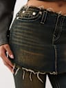 FALDA BECCA DE TIRO MEDIO SOBRE JEANS CORTE DE BOTA