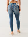 JEANS SKINNY JENNIE DE TIRO MEDIO CON COSTURA BIG T