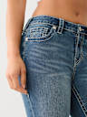 JEANS SKINNY JENNIE DE TIRO MEDIO CON COSTURA BIG T