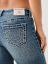 JEANS SKINNY JENNIE DE TIRO MEDIO CON COSTURA BIG T