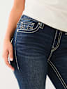 JEANS SKINNY CURVILÍNEOS JENNIE BIG T DE TIRO MEDIO