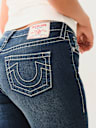 JEANS SKINNY CURVILÍNEOS JENNIE BIG T DE TIRO MEDIO