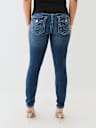 JEANS JENNIE SKINNY CURVILÍNEOS DE TIRO MEDIO BIG T