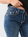 JEANS JENNIE SKINNY CURVILÍNEOS DE TIRO MEDIO BIG T
