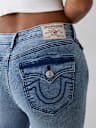 JEANS SKINNY CURVILÍNEOS JENNIE DE TIRO MEDIO