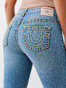 JEANS SKINNY CURVILÍNEOS JENNIE BIG T DE TIRO MEDIO