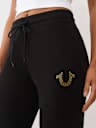 PANTALONES JOGGER CON HERRADURA DE CRISTALES