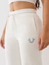 PANTALONES DEPORTIVOS CON PIERNAS RECTAS Y HERRADURA