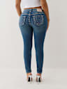 JEANS SKINNY JENNIE CURVILÍNEOS DE TIRO MEDIO BIG T