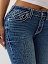 JEANS SKINNY JENNIE CURVILÍNEOS DE TIRO MEDIO BIG T