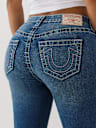 JEANS SKINNY JENNIE CURVILÍNEOS DE TIRO MEDIO BIG T