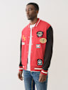 MULTI PATCH FLEECE VARSITY JACKET