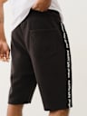SILICONE LOGO TAPING SWEAT SHORT