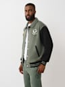COLLARED PATCH FLEECE VARSITY JACKET