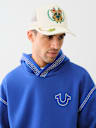 EMBROIDERED CREST TRUCKER HAT
