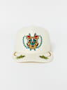 EMBROIDERED CREST TRUCKER HAT