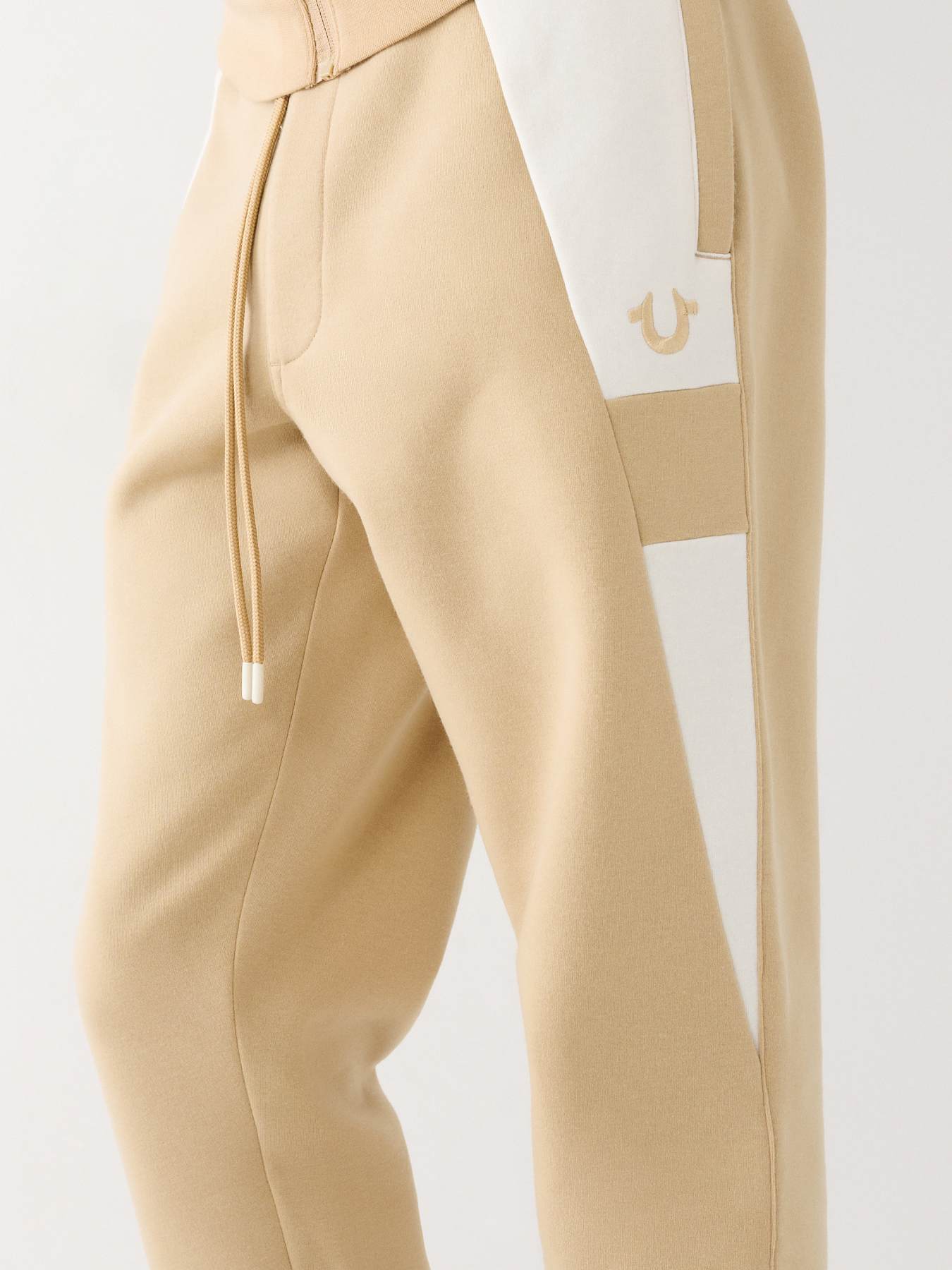 1050~RE-EDITION Front-pleated Joggers with Embroidered Logo main image 1