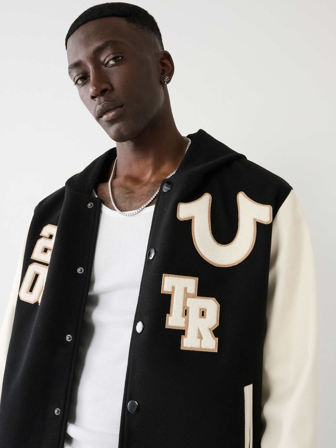 HOODED VARSITY JACKET