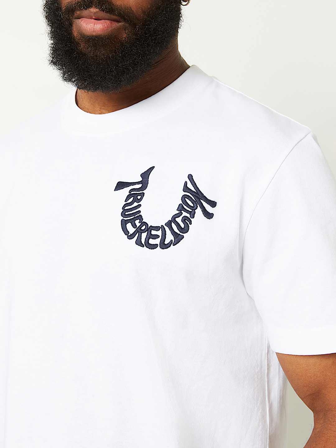 EMBROIDERED WARPED HORSESHOE TEE