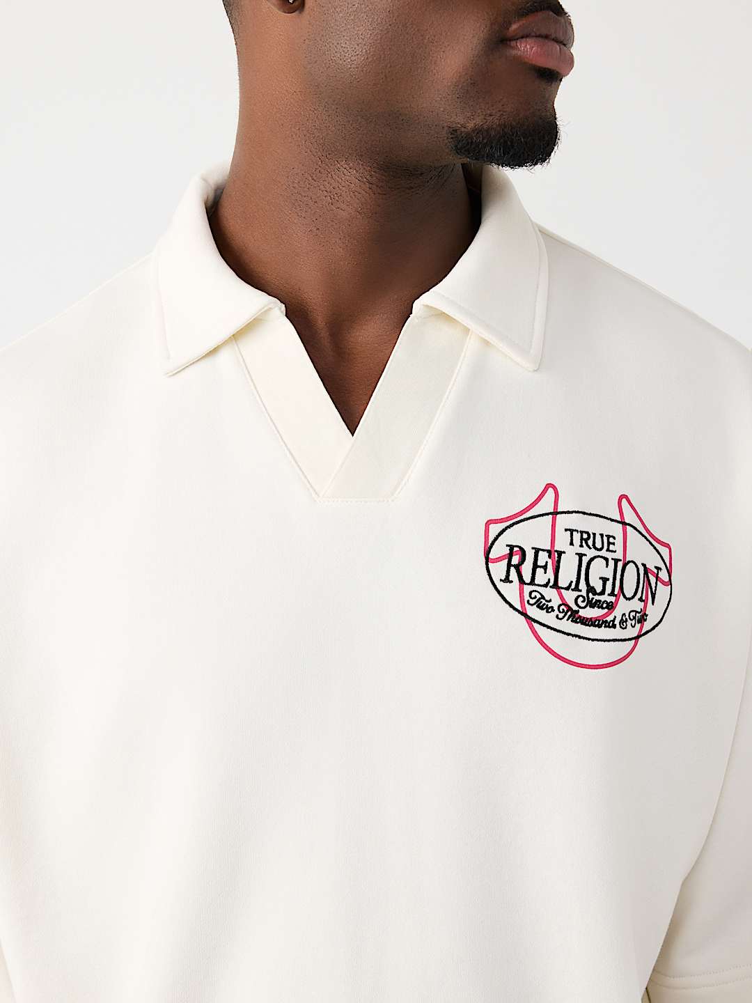 POLO SURDIMENSIONN&Eacute; AVEC LOGO DE TIGRE