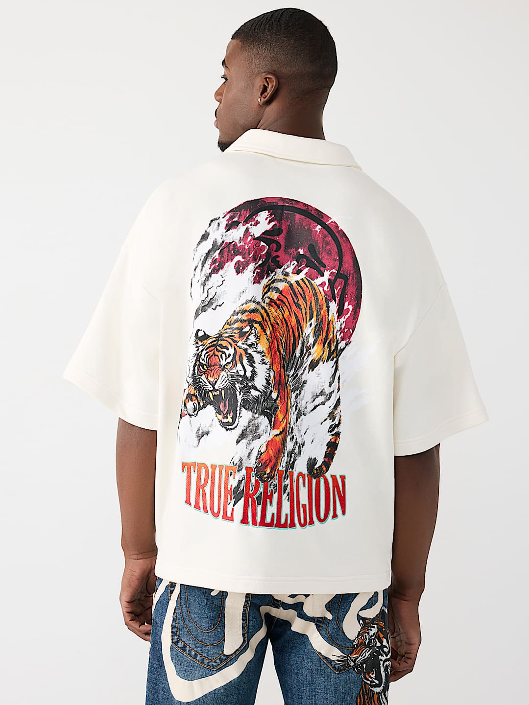 POLO SURDIMENSIONN&Eacute; AVEC LOGO DE TIGRE