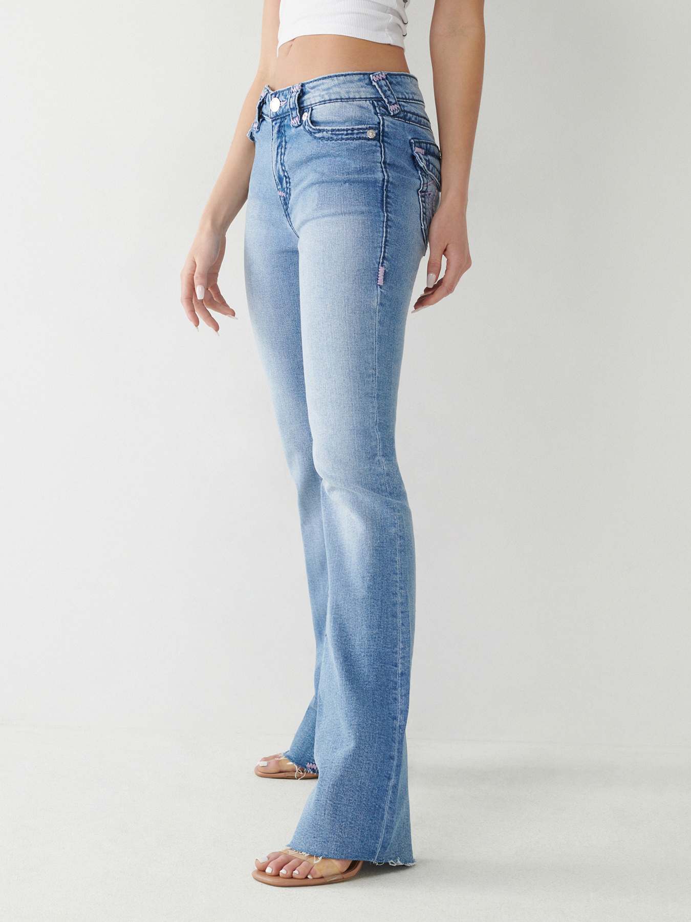 Flared jeans in mid blue with matching stitch, long