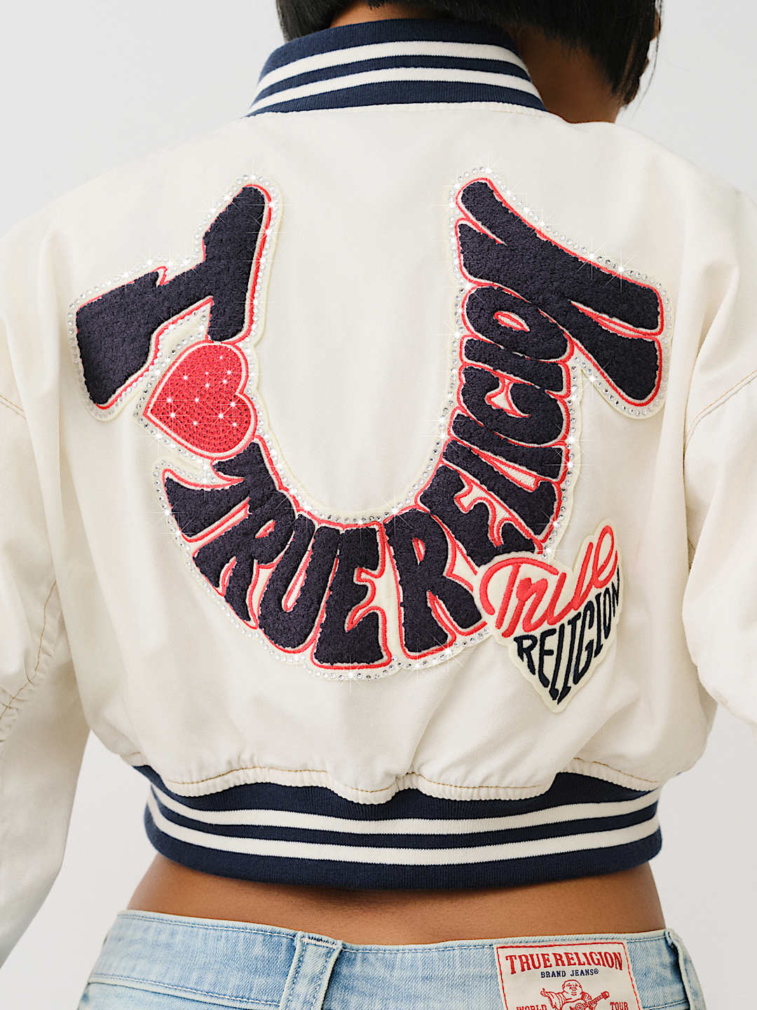I LOVE TRUE RELIGION' CROPPED VARSITY JACKET - Winter White